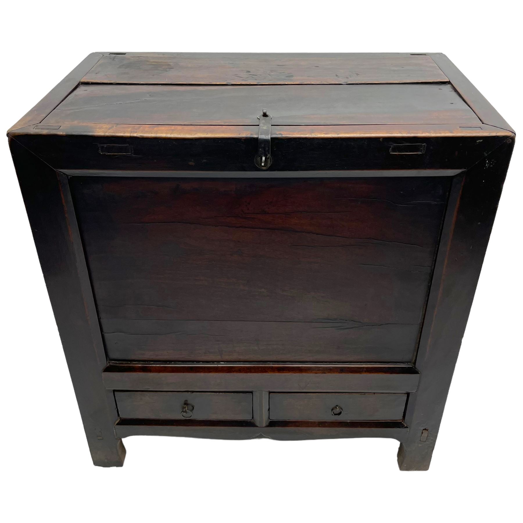 17th to 18th century Chinese fruitwood chest, possibly Gansu region, the lift-up lid with an iron strap set with two Chinese 'cash' coins, panelled front, sides and back, fitted with two small drawers, stile supports with shaped lower rail
