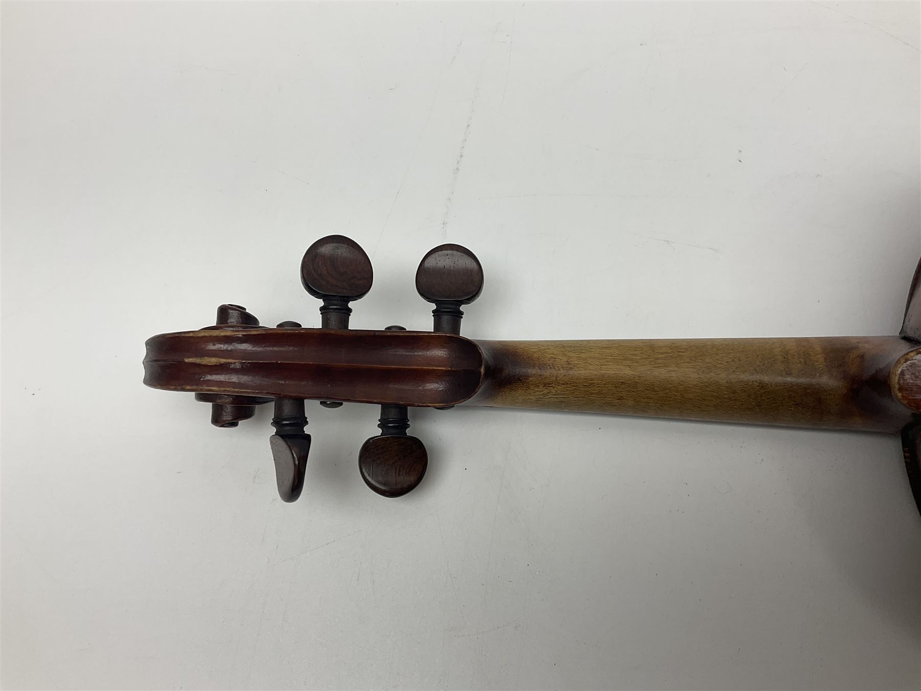 German violin c1890 with 36cm two-piece maple back and ribs and spruce top; bears label 'Antonius Stradivarius Cremona Faciebat Anno 1729' L59.5cm overall; in ebonised wooden 'coffin' case; and two German violins c1890 for completion - one bearing a Stradivarius label, the other a Ruggeri label; both in carrying cases (3)