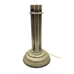 A silver plated table lamp, in the form of three columns upon a reeded circular spreading base with beaded edge, H38.5cm. 