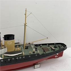 Large scale model of the motor Tug Turmoil, in OTS colours, on wooden stand, L135cm, W26cm, H66cm. Built 1945 the Turmoil was sent to the rescue of the Flying Enterprise in 1952. The Captain had refused to leave the ship, the vessel eventually sank under tow to Falmouth. Turmoil was scrapped in 1986. 