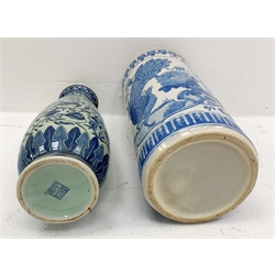 A Chinese blue and white umbrella stand, of cylindrical form decorated with birds perched upon blossoming branches H45cm, together with a Chinese tall blue and white vase of tapering form, decorated with birds amongst foliate tendrils, character mark beneath H46.5cm.