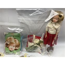 1960s Palitoy Tressy fashion doll, boxed with stand and booklets; four additional Tressy outfits (In The Office, Winter Journey, Winter Sports and Evening Date); two other outfits; and Tressy's Little Sister Toots doll with Style Book and additional outfit