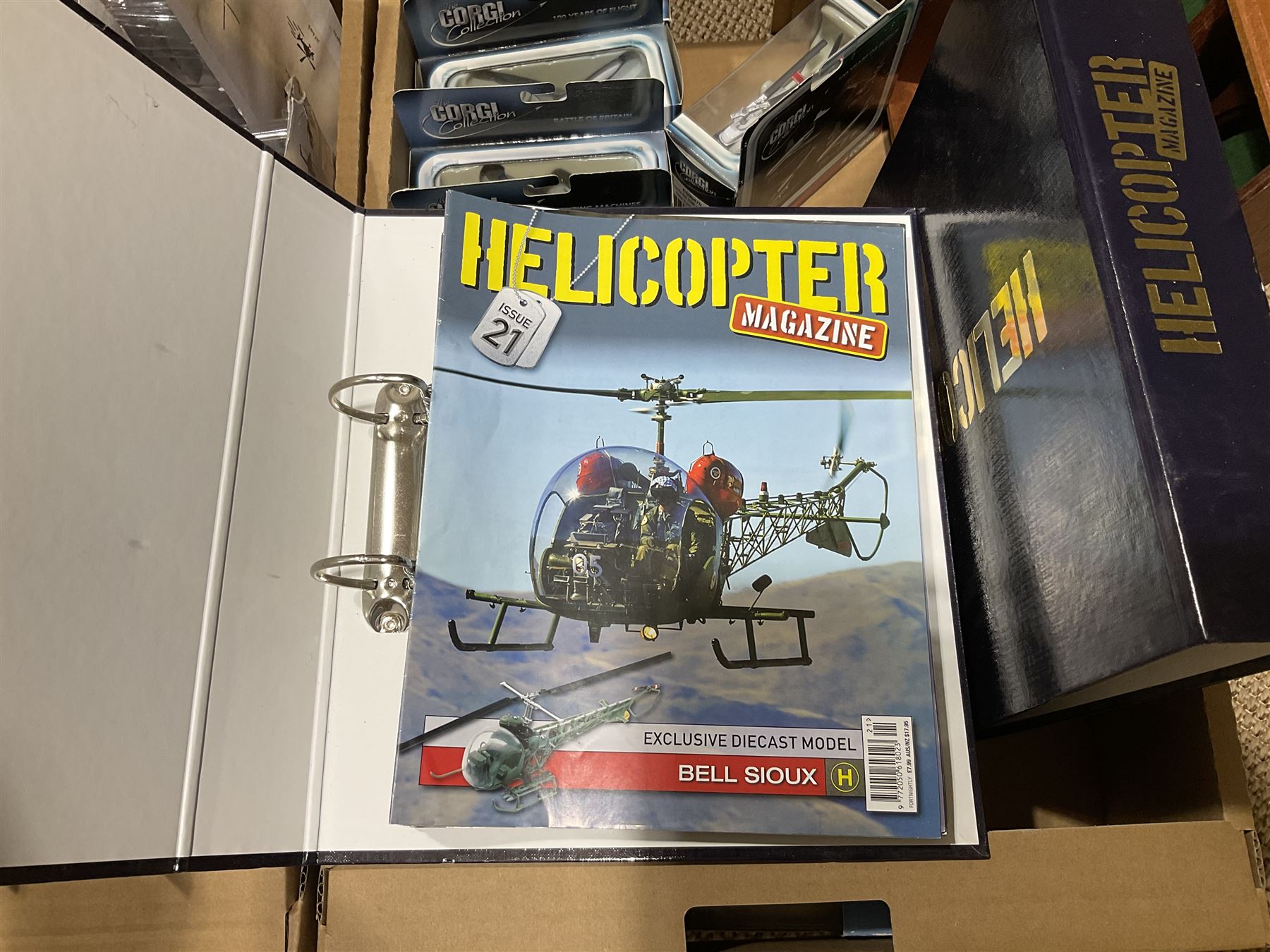 Thirty-six Amer Czechoslovakia periodical issued metal models of helicopters in original packaging; with thirty-nine issues of 'Helicopter Magazine' in two original binders; together with eight Corgi Collection die-cast military models; all boxed; and two others with small display rack; in three boxes