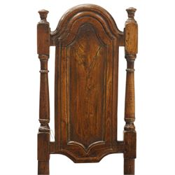 17th century oak and elm hall chair, the high-back with shield-shaped fielded panelling flanked by turned uprights, over a panelled seat, raised on turned supports united by H-stretcher with moulded serpentine front-stretcher