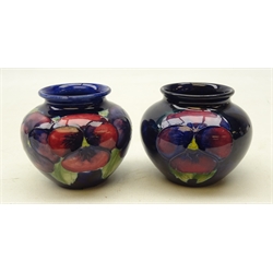  Two Moorcroft Pansy pattern baluster vases on blue ground, H7cm (2)  