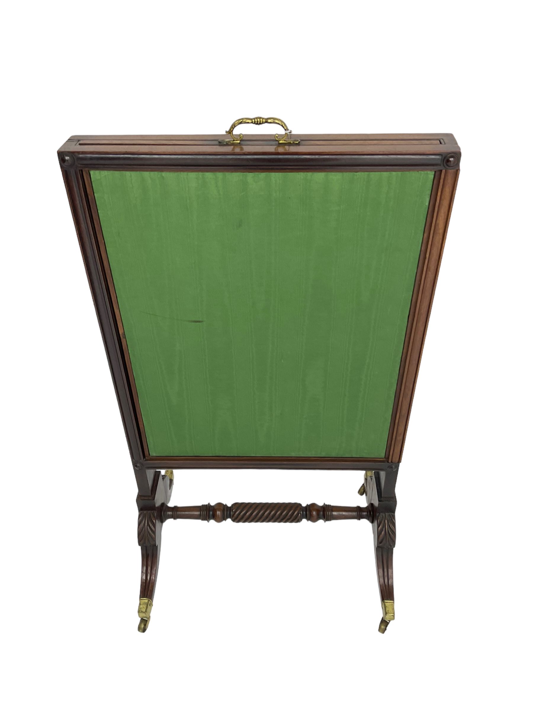 Regency mahogany screen with two horizontal and one vertical pull-out panels, on base with carved sabre legs and rope-twist stretcher