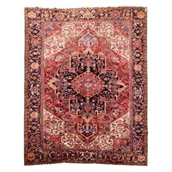 North West Persian Heriz hand-knotted carpet, madder red field with large central stepped ...
