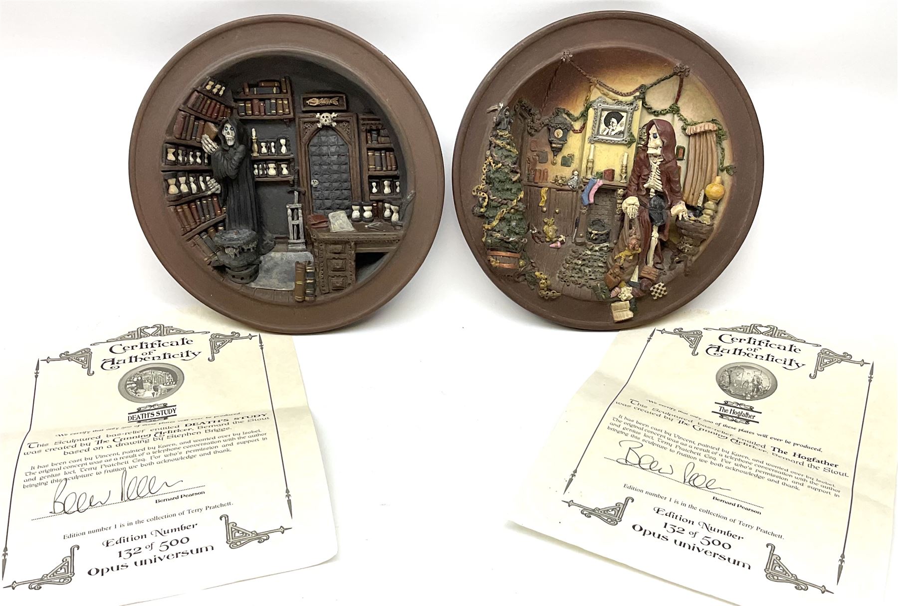 Two Terry Pratchett Discworld limited edition sculptured bas-reliefs, designed by Clarecraft, comprising Death Study created by 'the cunning artificer, Bernard the stout', 132/500 and The Hogfather, created by 'the cunning artificer, Bernard the stout', 132/500, both with certificates of authenticity.   