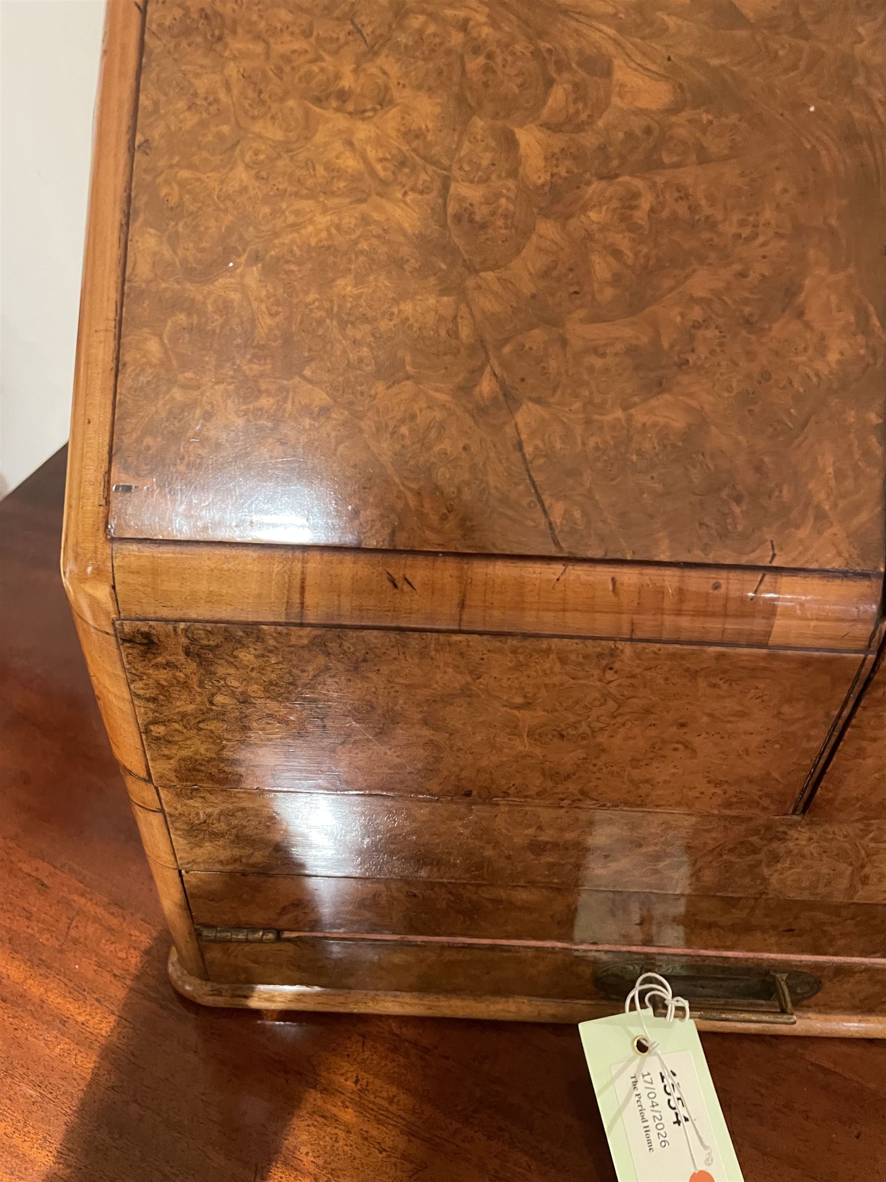 19th century burr walnut correspondence box, the sloped front opening to reveal a fitted interior with perpetual calendar, letter racks, and pen tray between two inkwell recesses, above a pull out draw with recessed brass handle, H41cm L40.5cm D28.5cm