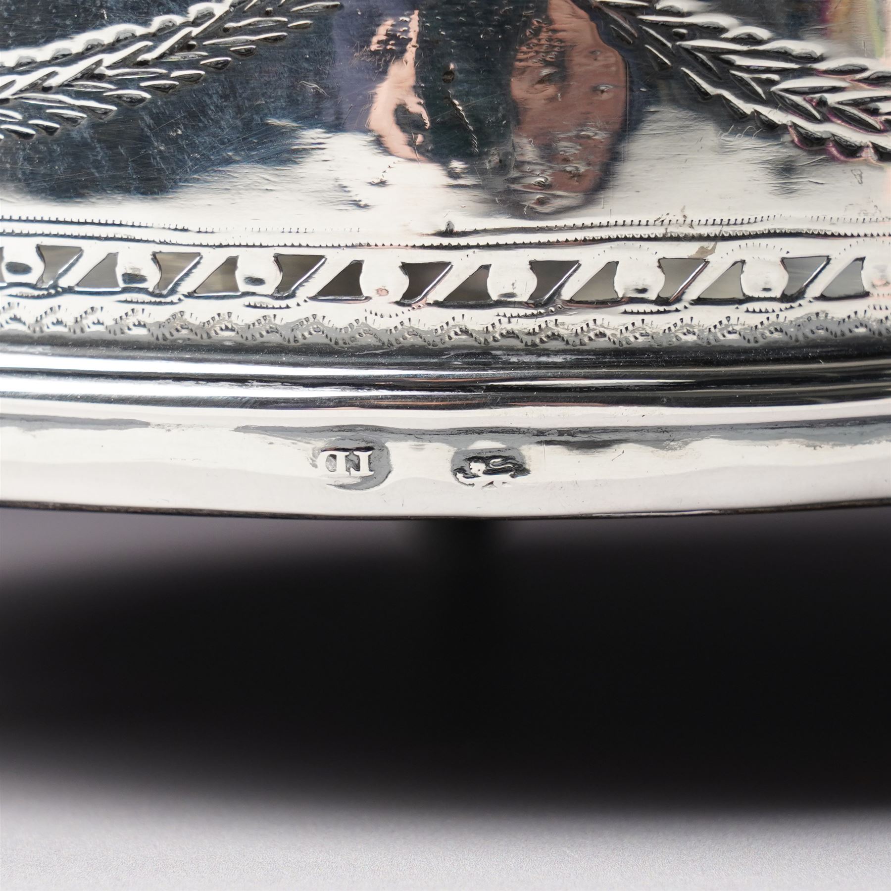 George III silver circular stand, originally a cruet stand, with pieced rim decorated with garlands and swags with turned wood base on claw and ball feet D14cm