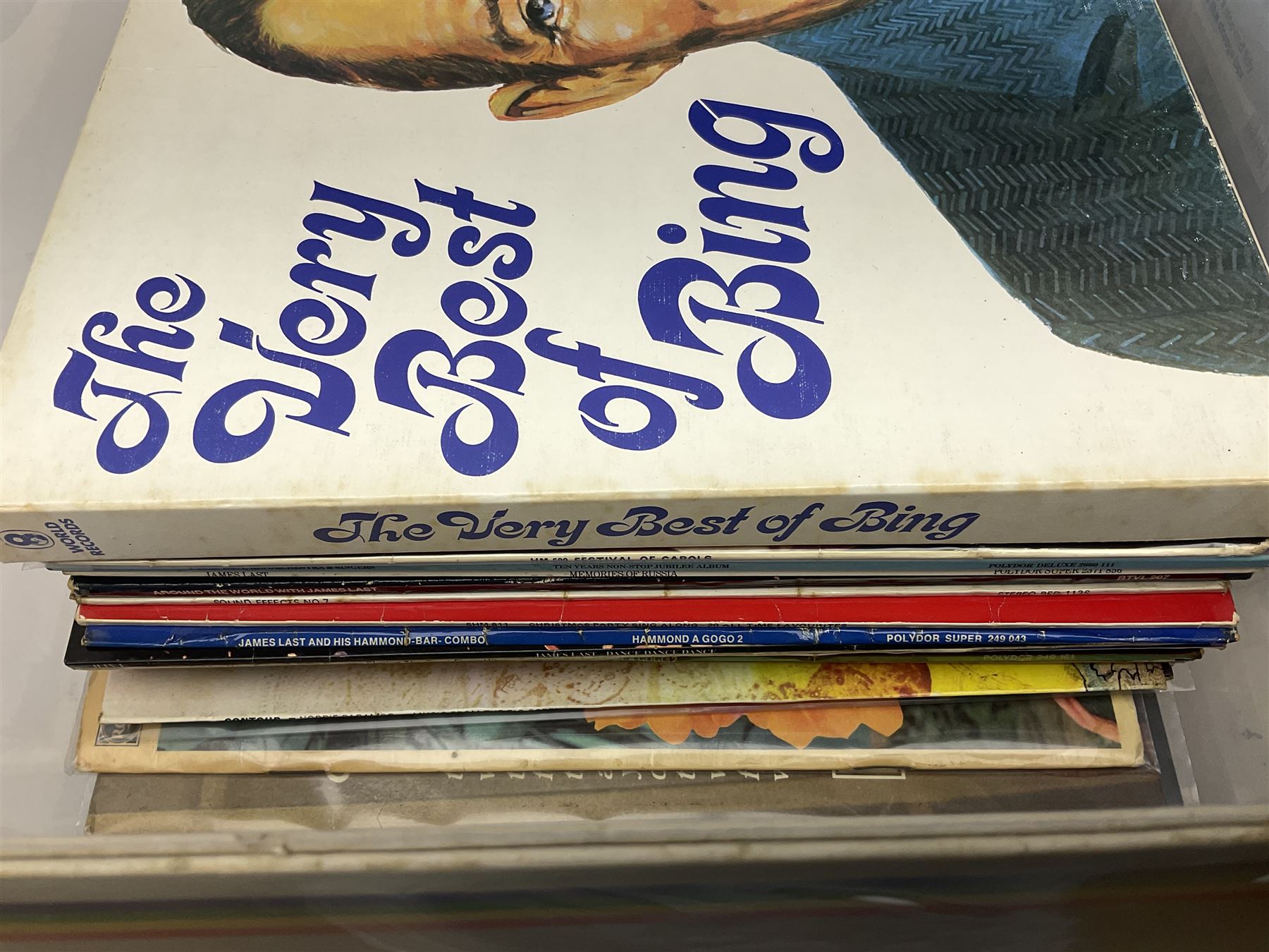 Large quantity of vinyl LPs, predominantly rock and pop, to include Elvis, Elton John, The Kinks, Deep Purple, Eurythmics, Whitney Houston, Phil Collins, Rolling Stones etc, in three boxes, together with quantity of 45 rpm records, Steepletone SRP1R-11 record player and record carry case