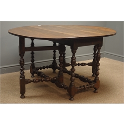  Early 20th century oak drop leaf table, gate action base, bobbin turned supports and stretchers, turned feet, W107cm, H72m, L133cm, (maximum measurements)  