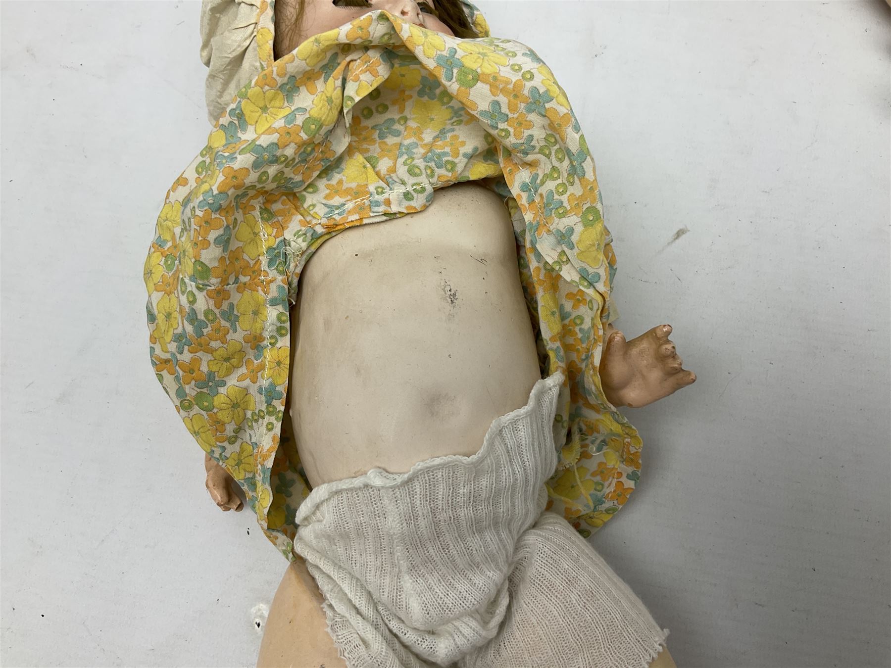 Carl Harmus Germany bisque head doll with applied hair, sleeping eyes, open mouth with teeth and composition body with jointed limbs; marked 'Harmus 313.4/0 Germany' H38cm; and Alt, Beck & Gottschalk Germany bisque head doll with applied hair, fixed eyes, open mouth with tongue and composition body with jointed limbs H44cm (2)