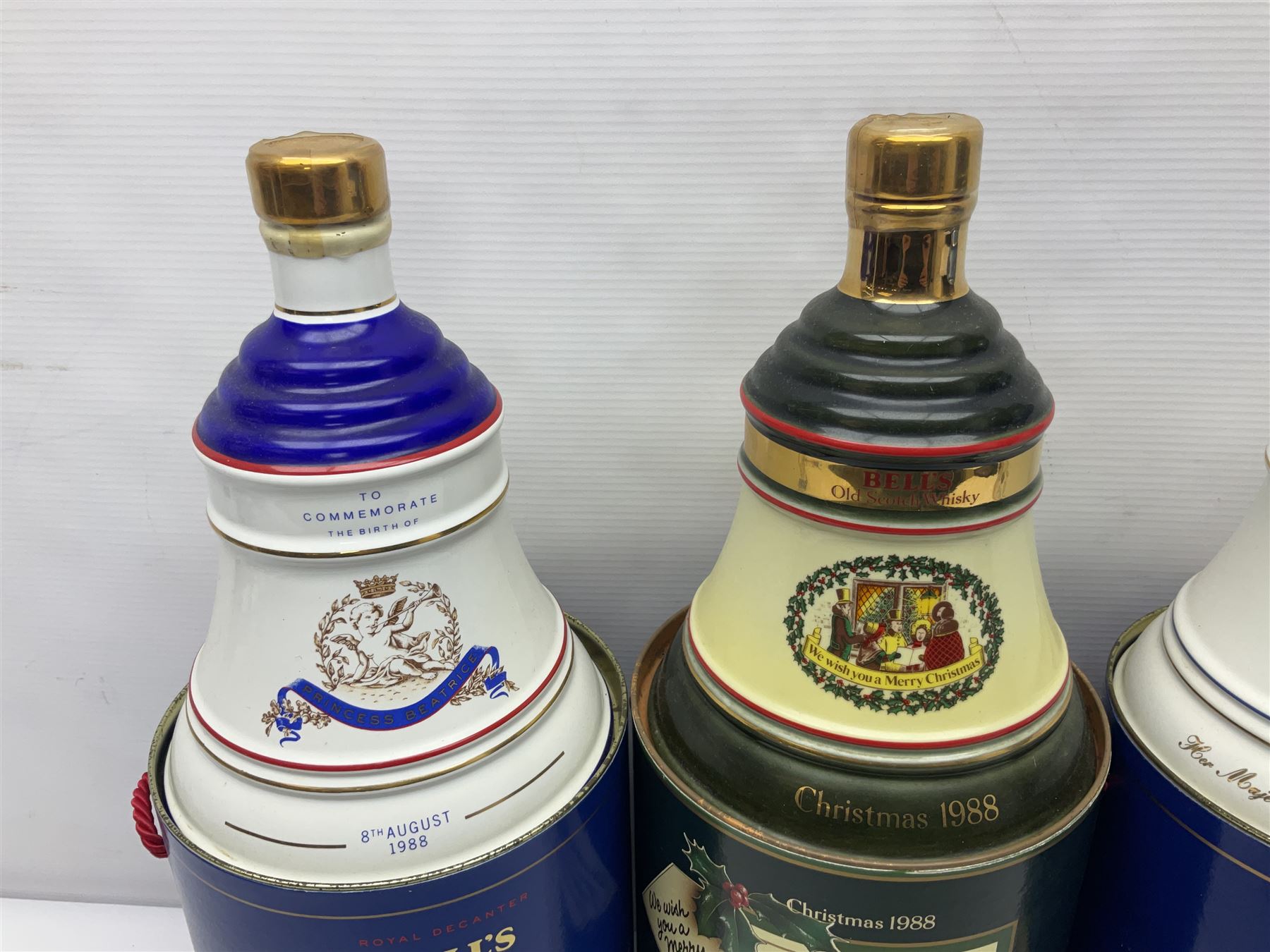 Bells, Scotch whisky, in seven Wade ceramic decanters, including Christmas 1988, 1989, 1990, 1991 etc