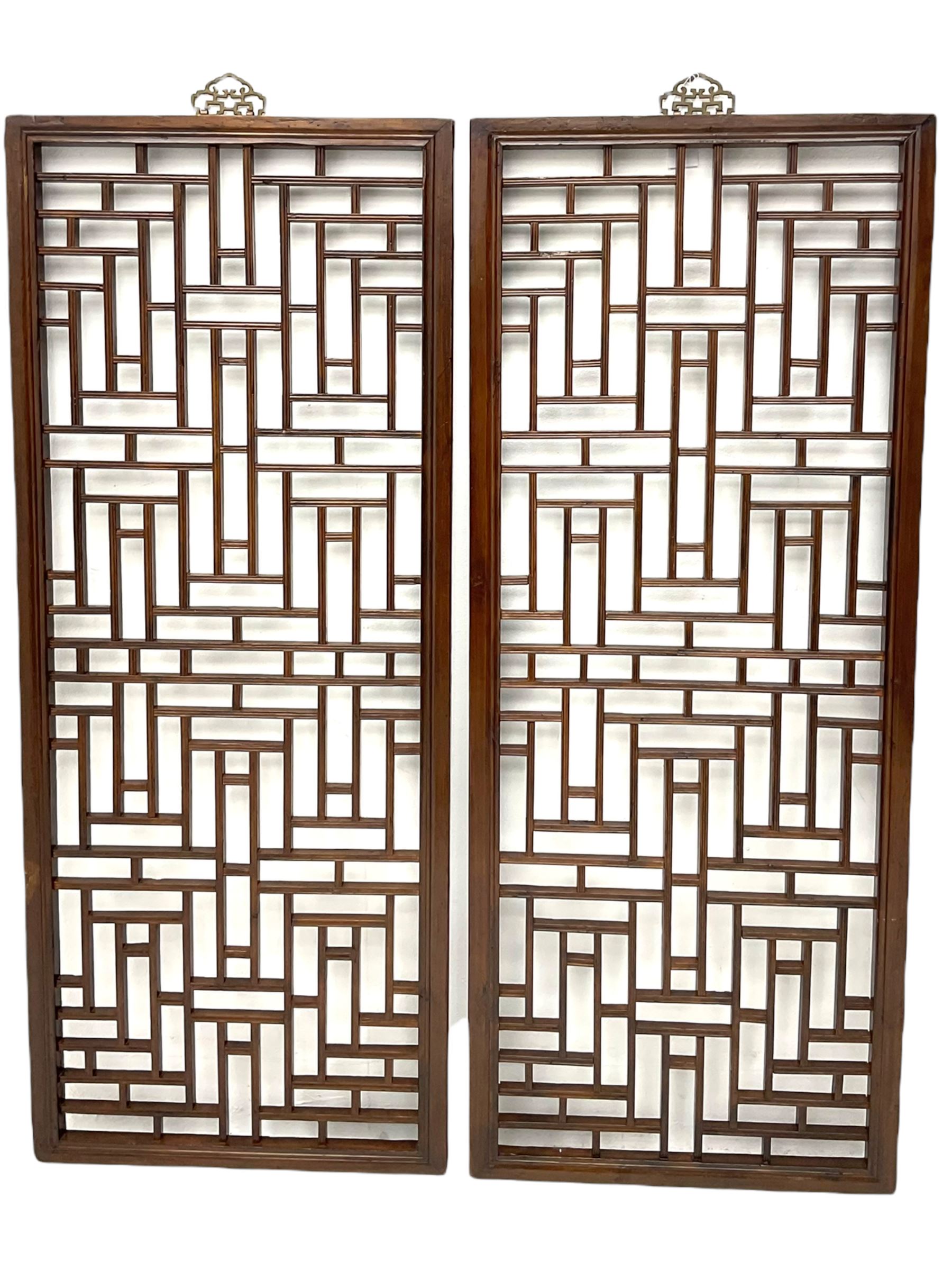 Pair 19th century Chinese lattice wall panels, in moulded frames with metal hangers, the lattice work with reed moulding