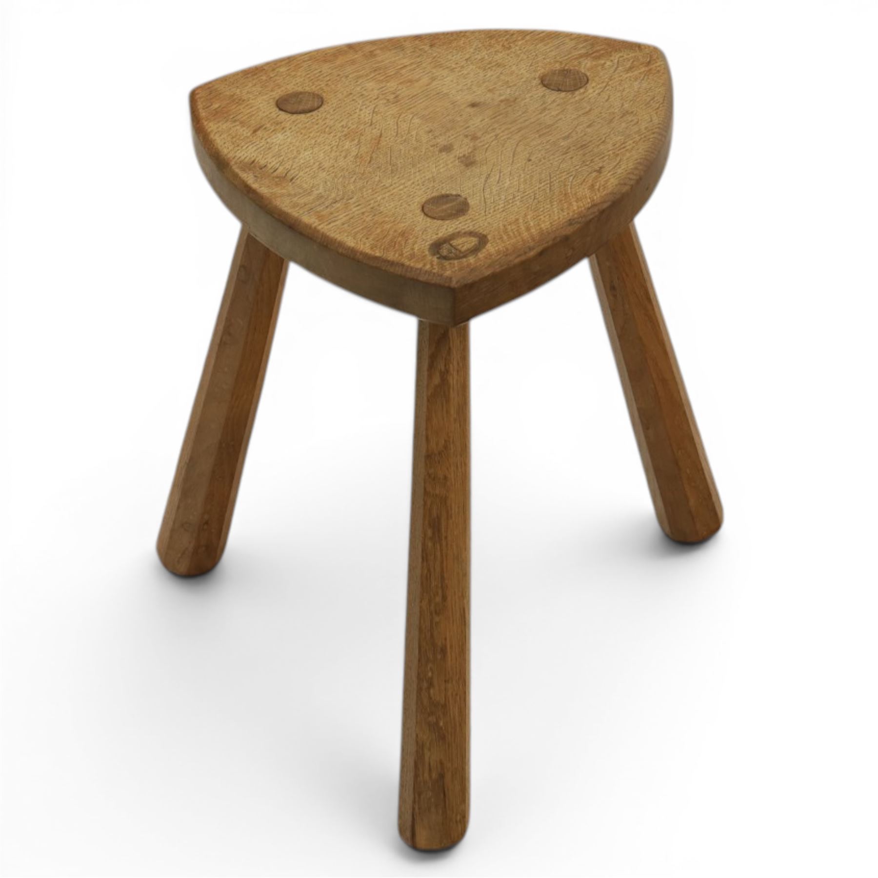 Acornman - oak milking stool, with signature acorn carving by the workshop of Alan Grainger of Brandsby