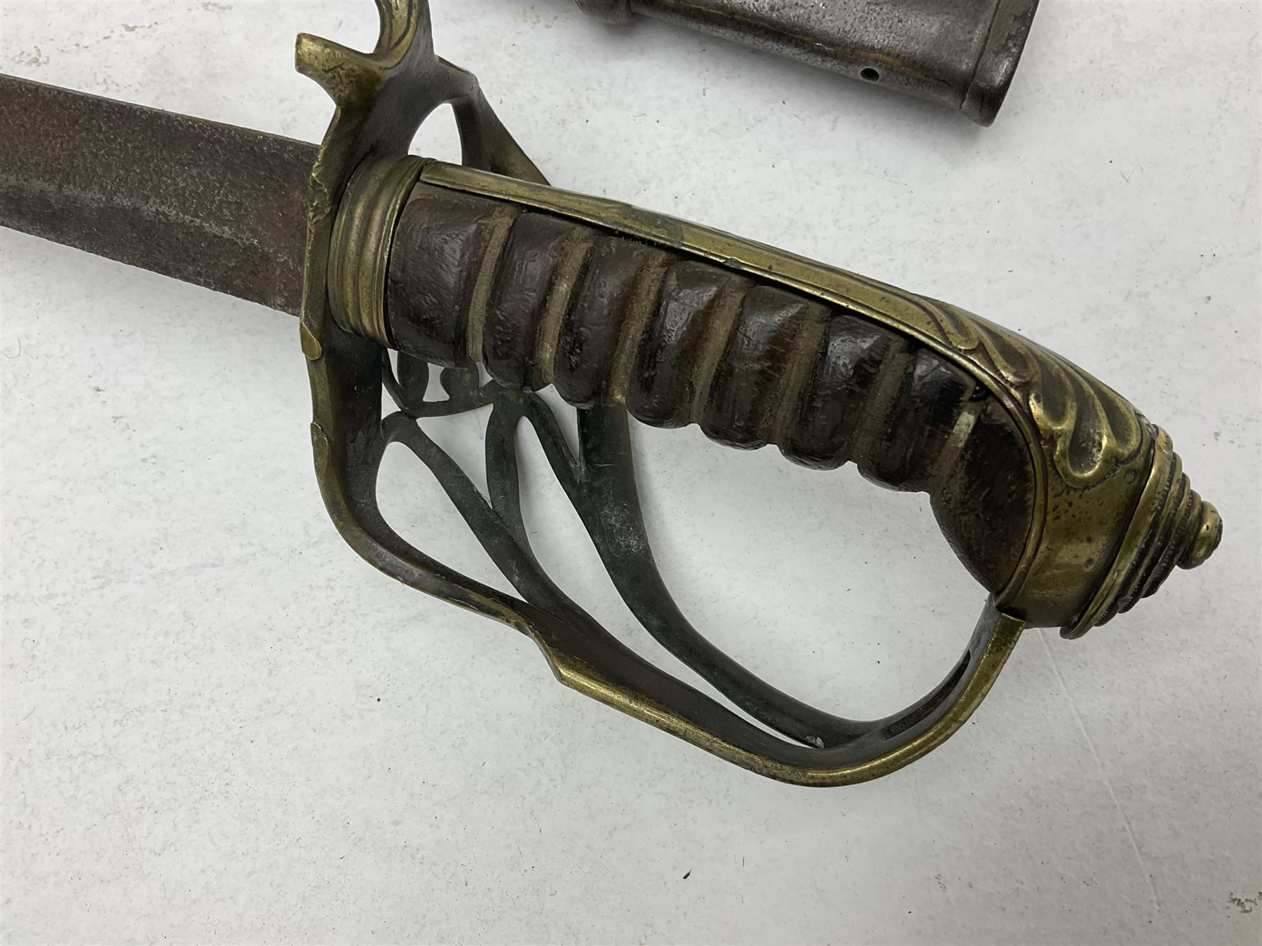 19th century Imperial German army heavy cavalry officers sword by Schnitzler and Kirschbaum, with 89cm single fullered steel blade and sheet steel basket hilt with teardrop cut-out and wire-bound leather grip L107.5cm overall; in steel scabbard with two suspension rings; and British Army 1822 Pattern Infantry Officer's sword in associated scabbard (2)