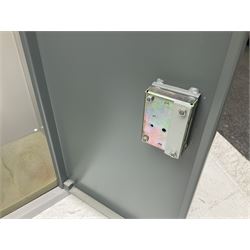 Two-tone grey steel wall-mounting gun cabinet by Sambell Engineering to accommodate six guns with fixed shelf over, gun space int. H132cm W36.5cm D23.5cm, the single double-locking door with two sets of keys, ext. H154cm W37cm D27cm