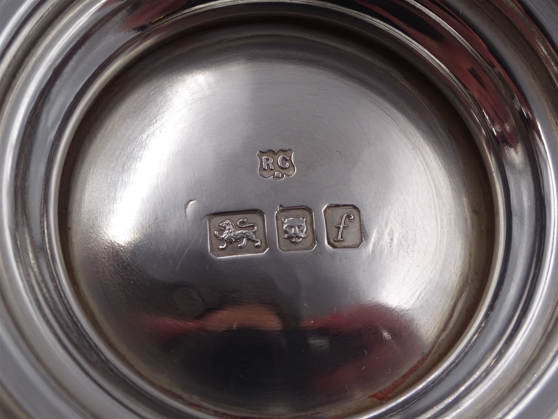 Mid 20th century three piece silver coffee service, comprising coffee pot, milk jug and twin handled open sucrier, of waisted form upon circular domed foot,  with oblique gadrooned rim, the milk jug and sucrier with acanthus capped handles, the coffee pot with wooden handle and finial, hallmarked William Comyns & Sons Ltd , London 1961, coffee pot H27.5cm