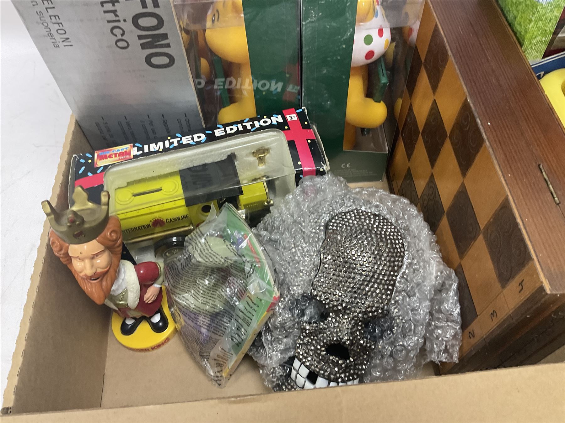 Collection of vintage and later toys and memorabilia to include Merlin’s Football sticker book, boxed child’s electric telephones, Only Fools and Horses money box, four boxed The Promenade Collection dolls etc in two boxes