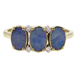 9ct gold three stone opal doublet ring, with four diamond accents set between