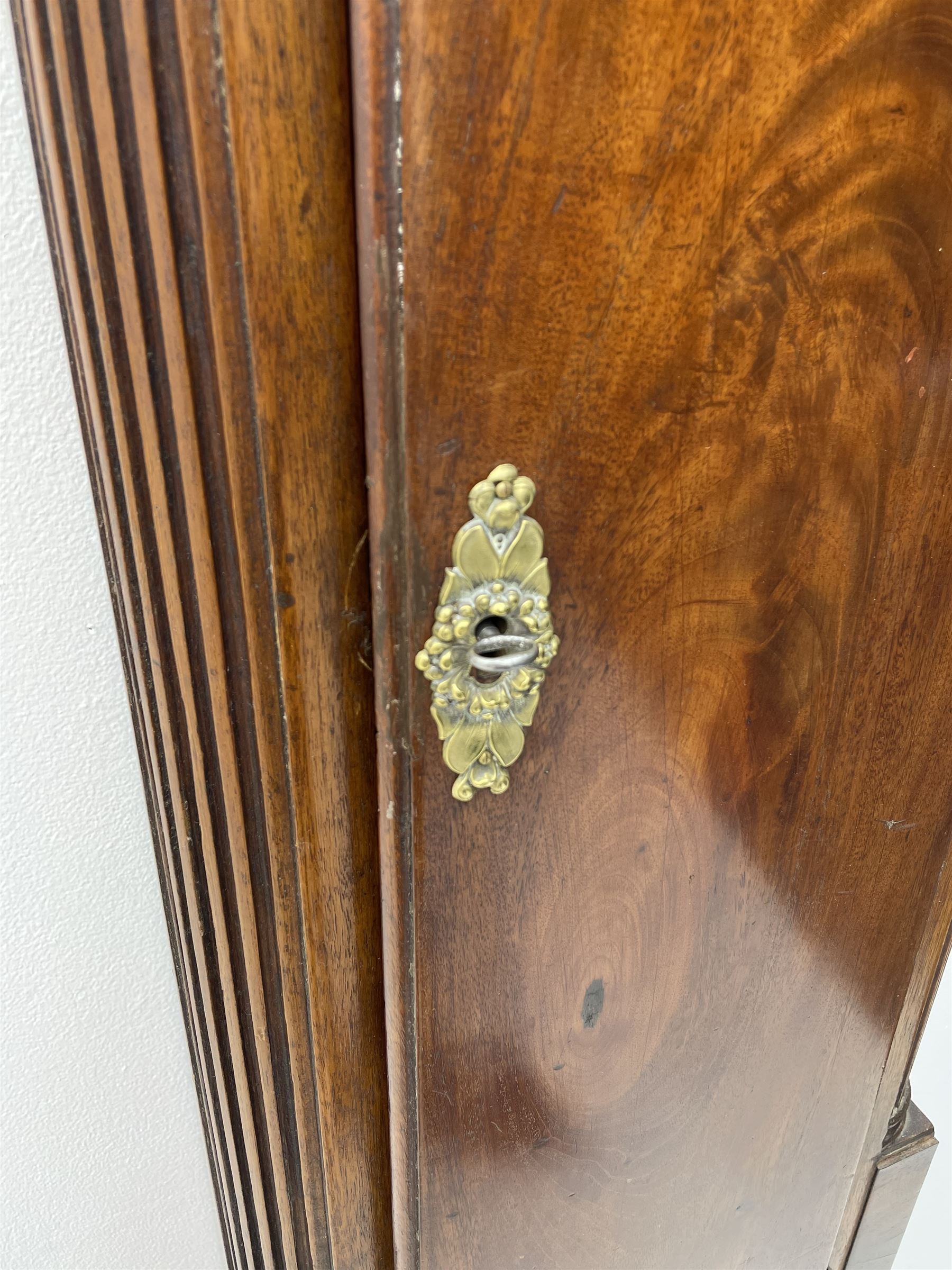 Late 18th century clock movement and dial, square brass dial with Arabic and Roman chapter ring signed 'Thos. (Thomas) Johnston, Dublin', with subsidiary seconds dial and calendar aperture, the dial set with ornate mask cast spandrels, twin train eight day movement striking on bell, with anchor escapement (34.5cm x 34.5cm, 13 1/2