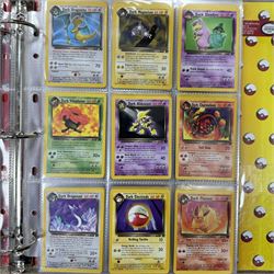 Collection of approximately 400 Pokemon trading cards, mostly 1999 Wizards Pokemon cards to include 1st Edition Dark Gyarados holo 8/82, Dark Charizard 4/82 holo and 21/82 non holo, Dark Blastoise 3/82 holo and 20/82 non holo, Dark Raichu holo 83/82, Dark Dragonite 22/82, eleven first edition cards, Japanese cards, Trainer cards, etc, together with an album of Pokemon the First Movie cards, a voice actor signed copy of Pokemon: The First Movie Animation Comics Mewtwo Strikes Back #1, 5305/8000 with certificate of authenticity with comics 2, 3 and 4 
