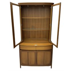 Nathan - teak wall display unit, raised display cabinet enclosed by two glazed doors, the lower section fitted with two drawers and double panelled cupboard 