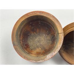 Three 19th century coquilla nut pomanders or flea catchers, two of egg shaped form and the third of barrel from with carved and pierced decoration and screw threaded join, largest H8cm