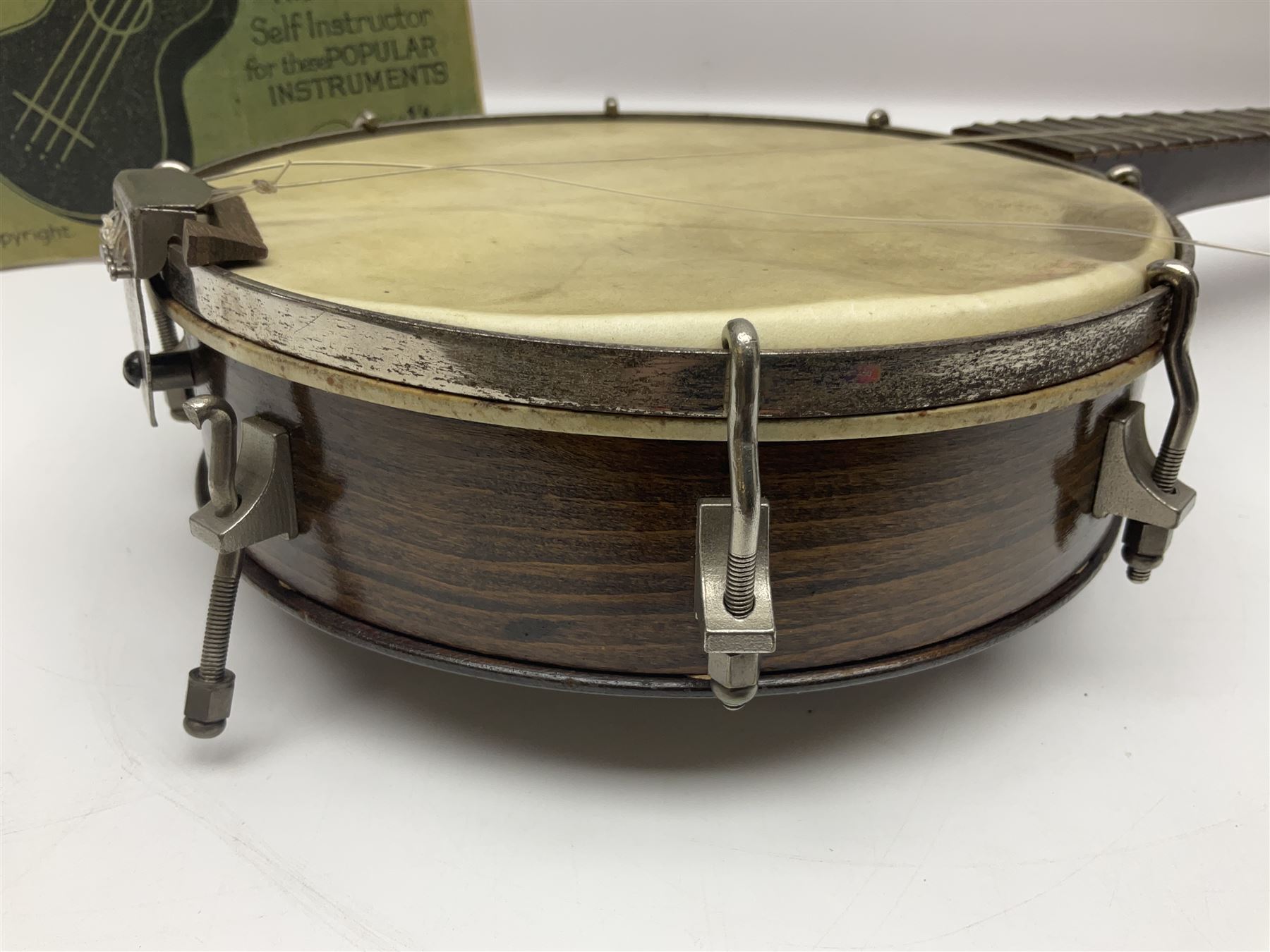 George Formby banjolele with metal plaque to headstock L55cm; in carrying case with instruction booklet.