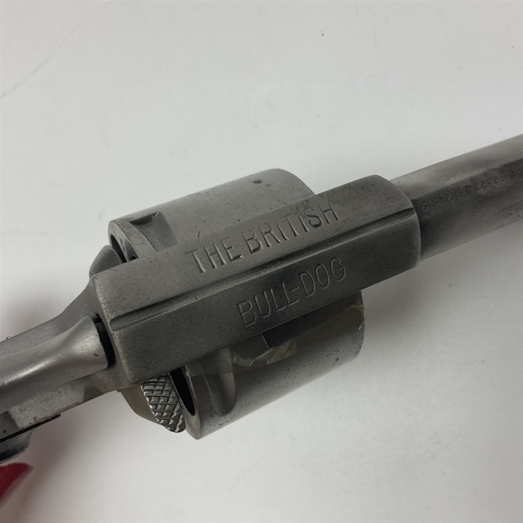 The major parts only of a British Bull-Dog .500 Boxer five-shot revolver comprising stripped down framework, cylinder, trigger with guard, functioning hammer and two-piece chequered grip; retailed by G. Goth Buenos Ayres; Belgian proof marks; L19.5cm overall; in fitted mahogany case 