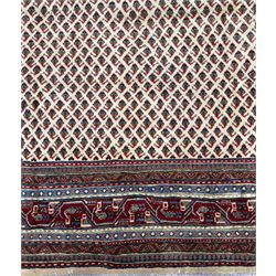 Northwestern Persian Bottehmir hand-knotted rug, ivory field with an all-over design of boteh motifs arranged in diagonal rows within multiple borders and a primary madder red field with stylized vine and flowerhead motifs, 320cm x 214cm 