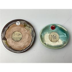 Henry George Murphy (1884-1939), collection of seven Arts & Crafts glazed ceramic roundels, of circular and oval form, five in tones of red and brown and two in tones of blue, turquoise and green in soufflé and high fired finishes, largest example D6.5cm