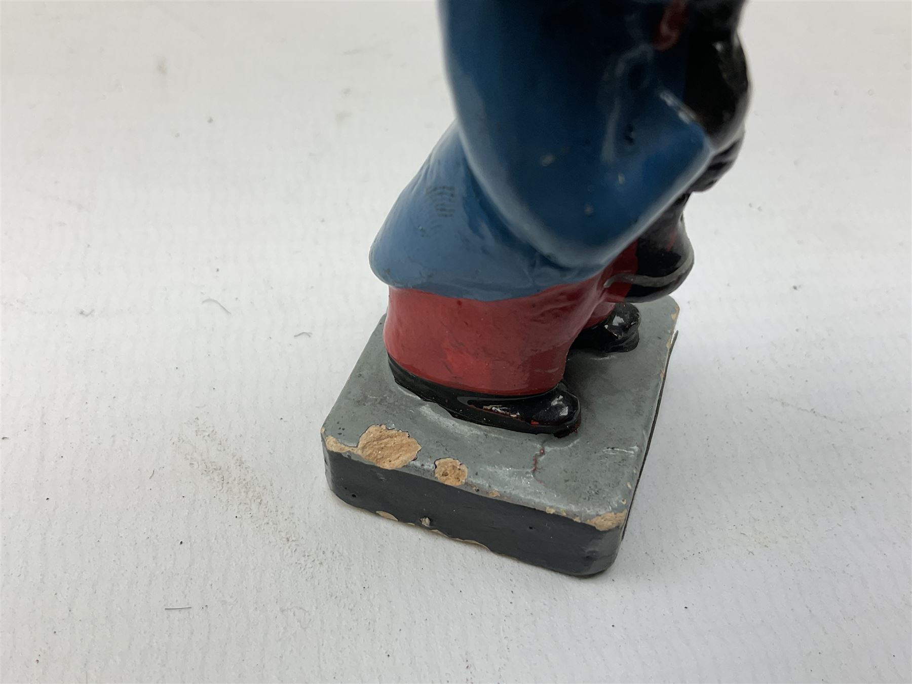 Robinson Jam plaster Golly band, including drummer and singer, H7.5cm

Originally handmade by mothers in Africa for their children from old fabric and cloth, the golly doll was adopted as the mascot and trademark for the Robertson's confectionery brand around 1910 after the company's founder John Robertson visited the US and noticed children playing with them. Robertson's Gollies have been collected by people across the UK and around the world for generations but garnered a contentious image in the 1980s because of links to racism. The trademark was removed from Robertson's branding in 2001.