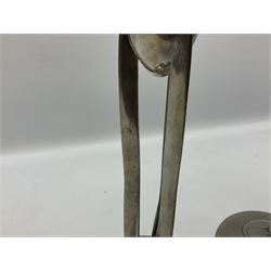 Archibald Knox (1864-1933) for Liberty & Co, pair of Tudric pewter candlesticks, the bud shaped sockets raised upon three angular fin supports and a slightly domed circular base with cast stylised foliate decoration, each stamped beneath Tudric 0223, H30cm