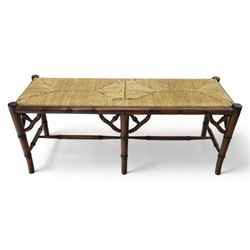 Faux bamboo long stool, stained beech frame with rectangular rush woven seat, rounded rail sides over ring-turned supports, united by side and end stretchers