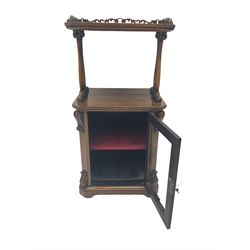 19th century rosewood etagere side cabinet, the upper tier with pierced gallery on two shaped and moulded supports with scroll carved decoration, the main body fitted with cabinet enclosed by glazed door, the door with shaped and carved slip, canted uprights with scroll carved corbels and brackets, on bracket skirt base