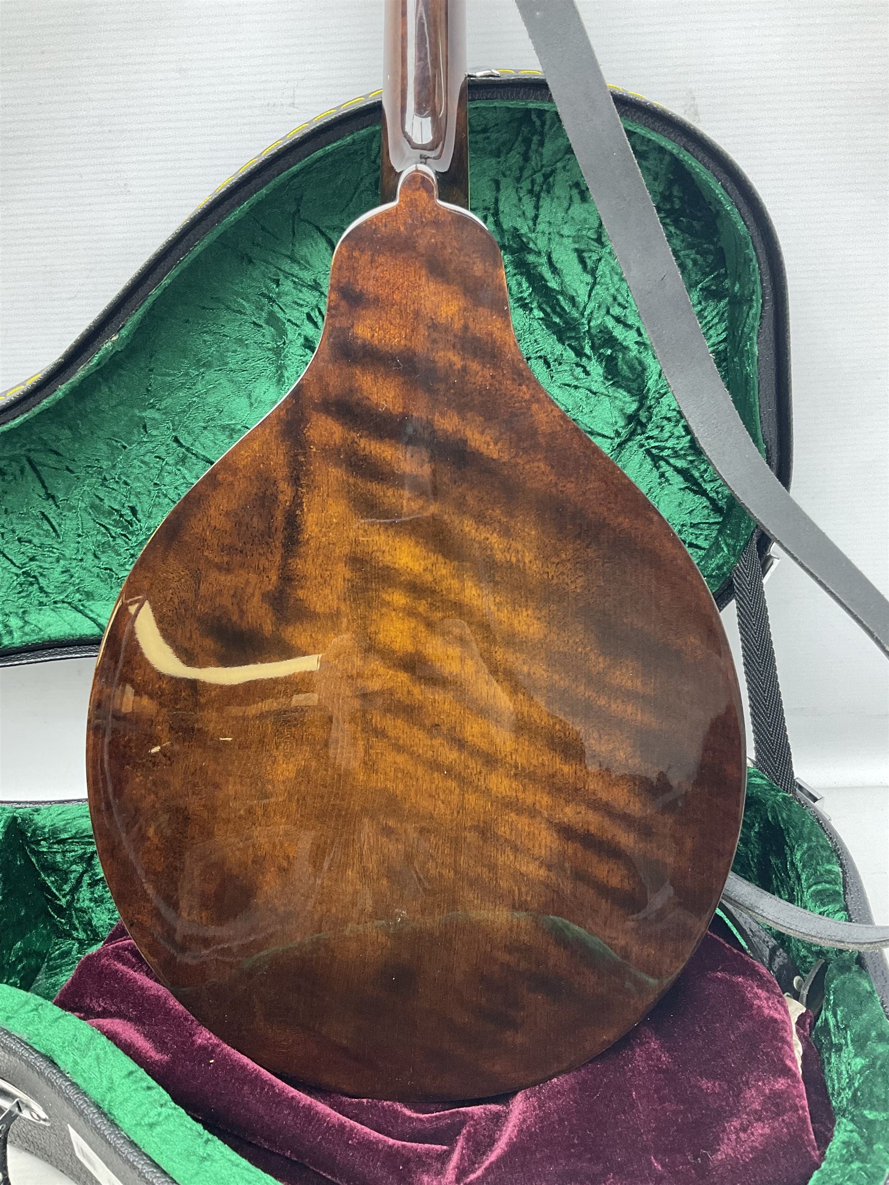 Eastman eight-string mandolin model MD504, serial no.140435406, L66cm; in TGI hard carrying case; together with case of instructional CDs