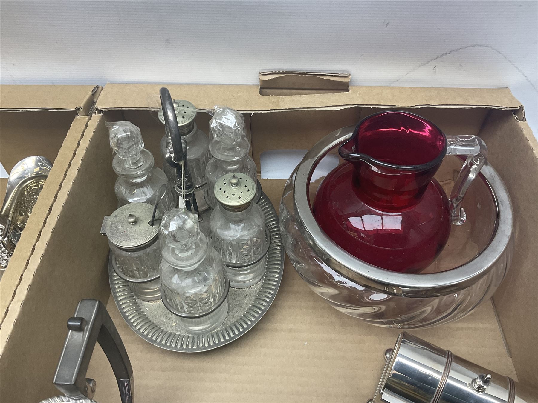 Uranium green glass vase, together with cranberry glass jug, glass dish with silver plate rim, glass cruet set etc, in two boxes 