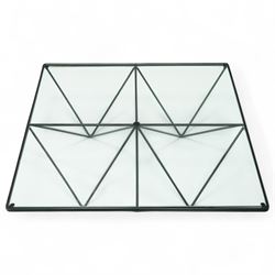 Paolo Piva for B & B Italia - Alanda coffee table with black powder-coated metal frame and clear glass top, the base with angular intersecting support struts forming a symmetrical design