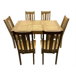 Distressed look oak table with butterfly extending mechanism and six matching chairs