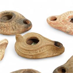 Antiquities; six Byzantine oil lamps, including terracotta examples, approximately 5th-7th century, having incised decoration, largest W10cm (6)