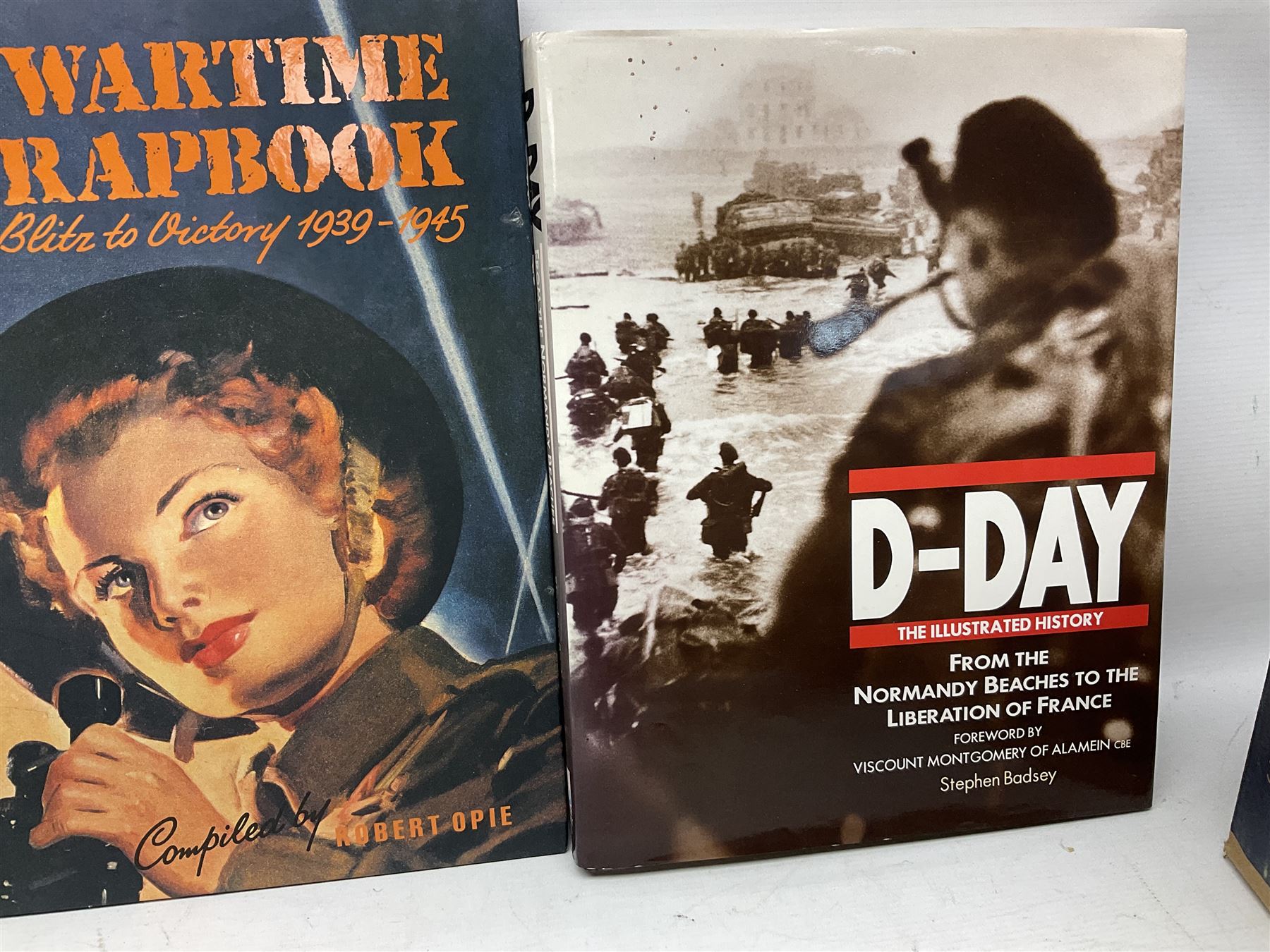 Thirty modern books of military interest including The Wartime Scrapbook 1939-1945; D-Day by Stephen Badsey; The D-Day Experience by Richard Holmes; Desert Rats by John Parker; A Most Secret Squadron by Des Curtis; Flying Colours - The Epic Story of Douglas Bader by Laddie Lucas etc; and quantity of DVDs of war and military interest