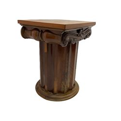 Victorian mahogany vanity unit in the form of a column, the scrolled top with hinged lid revealing mirror, wash bowl and toiletry dishes, on scalloped cylinder pedestal with single door, the interior fitted with shelf
