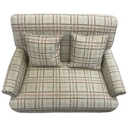 Traditionally shaped two-seat sofa, rolled back and arms, upholstered in checkered fabric, on turned front supports with brass cups and castors 