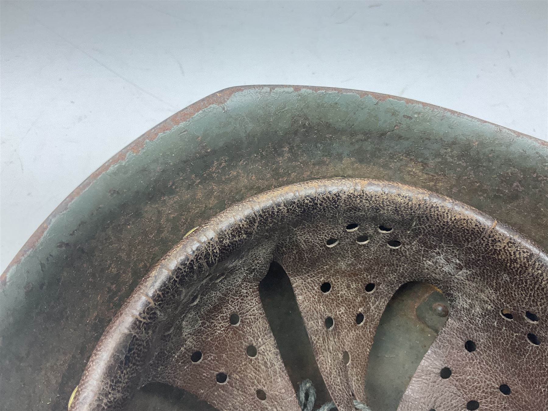 WWII Italian steel helmet with liner and chin strap
