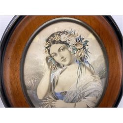 Pair of oval walnut frames with ebonised border, each containing portrait engravings of young female figures with flowers in their hair, overall H25.5cm W21.5cm
