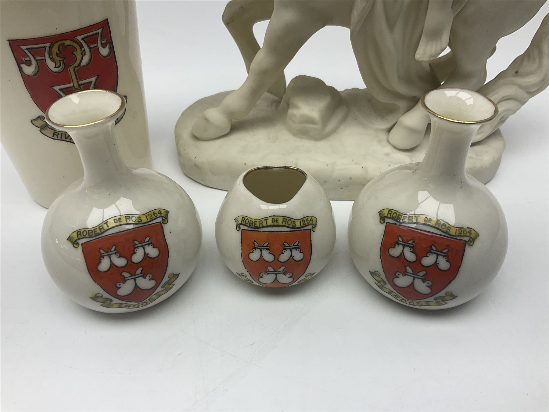 W.H.Goss Parian figure of Lady Godiva, with printed mark beneath, together with a W.H.Goss crested ware Rivaulx Abbey tumbler, and three similar Waterfall Heraldic China crested ware items, Godiva H19cm 