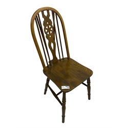 Set of four elm and beech Windsor design dining chairs, hoop and stick back with wheel splat, on turned supports united by H-stretchers 