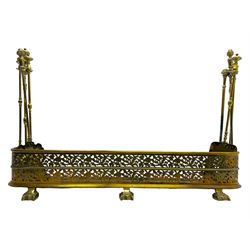 Victorian brass fire fender with companion set, D-shaped form and decorated with pierced and engraved trailing foliage with thistles, on three stepped and shaped feet